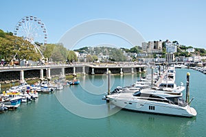 Torquay, outer harbour with boats against a view of the big wheel and Shirley Towers