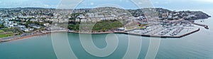 Torquay seafront aerial panorama image. English riviera with cafe\'s, bars.Torquay marina with boats and yachts .