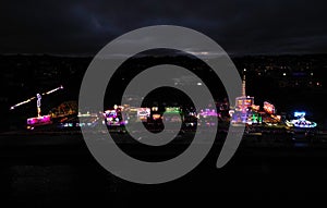 Torquay, Torbay, South Devon, England: DRONE VIEW: The summer funfair in full swing at night