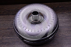 Torque converter on wooden background