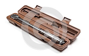 A torque wrench in a case. Close up. Isolated on a white background