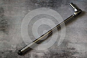 A torque wrench in a gray background