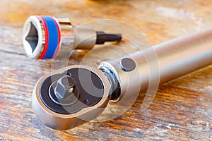 Torque wrench and spanner head on a wooden table in the workshop