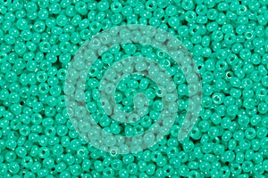 Torquoise seed beads.