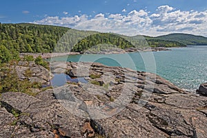 Torquoise Waters on a Forested, Rocky Inlet