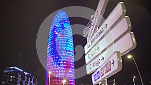 Torre Agbar office building sparkling with many colorful LED lights at night