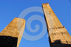 Torre Asinelli and Garisenda in sun and blue skies in Bologna (Italy)
