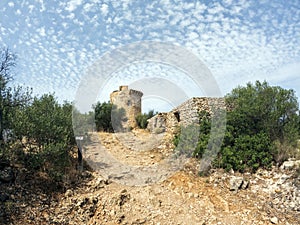 Torre de Cap Andritxol, an old observation tower in middle of hilly landscape on Mallorca close to seaside