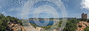 Torre de Cap Andritxol, an old observation tower in middle of hilly landscape on Mallorca close to seaside