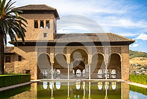 Torre de las Damas in a garden of the Alhambra in Granada, Spain