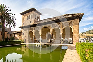 Torre de las Damas in a garden of the Alhambra in Granada, Spain