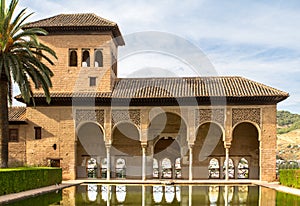 Torre de las Damas in a garden of the Alhambra in Granada, Spain