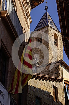 Torre de las horas in Solsona between a catalonia flag photo