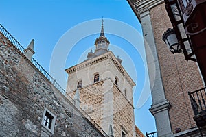 Torre del Alcazar de Toledo view from the Zocodover square with blue sky in the background. Toledo, Spain photo