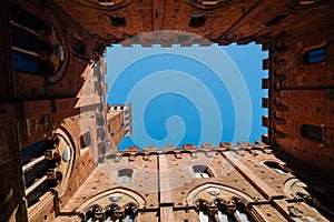 Torre del Mangia tower at Palazzo Pubblico in Siena, Italy