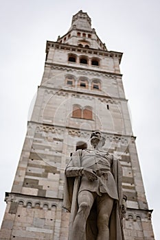 Torre della Ghirlandina tower with ancient statue of Alessandro Tassoni