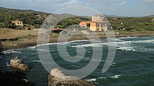 Torre della Tagliata or Puccini Tower, on the beach of Ansedonia photo