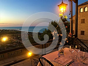 Torre di Palme town in Marche region, Italy. Sunset, sea, colours, restaurant and romantic view photo
