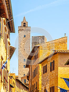 Torre Grossa, Big Tower. Bottom view from medieval streets of San Gimignano, Italy. photo