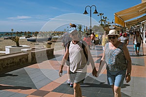 Torremolinos, Malaga, Spain, may 8, 2019. People walking at promenade