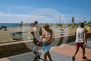 Torremolinos, Malaga, Spain, may 8, 2019. People walking at promenade