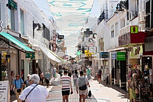 TORREMOLINOS, SPAIN, Andalusia, Costa del Sol - May 21, 2019. Shopper and tourists are walking along most popular street in old