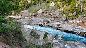 Torrential river in a forest in San Martin de los Andes, Neuquen, Argentina