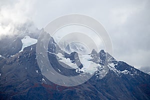 The Torres del Paine mountains in the clouds in autumn, Torres del Paine National Park, Chile