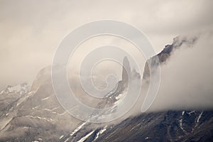 The Torres del Paine mountains in the clouds in autumn, Torres del Paine National Park, Chile