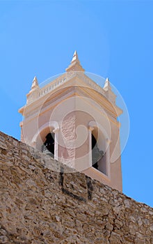 TorreÃÂ³n de la PeÃÂ§a ancient fortified wall and the tower bell o photo