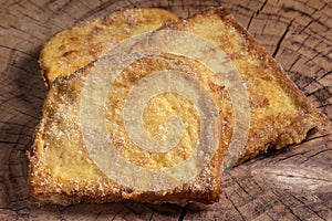 (Torrijas) Fried bread soaked in milk flavored with vanilla, cinnamon, lemon and egg