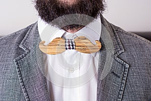 Torso of a bearded man in a suit