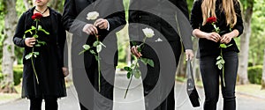 Torso of family on cemetery mourning photo