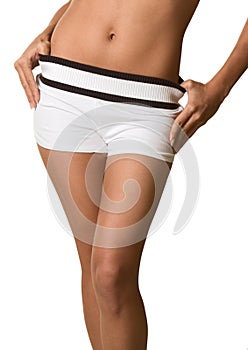 Torzo a boky ženy v bílý šortky holý břicho 