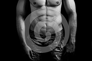 Torso of muscular man with abdomen photo
