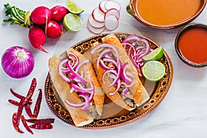 Tortas ahogadas, traditional Mexican Food from Jalisco Guadalajara Mexico, spicy sandwich in a red sauce