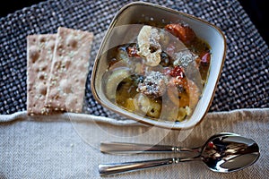 Tortellini Sausage Soup with Crackers and Spoons
