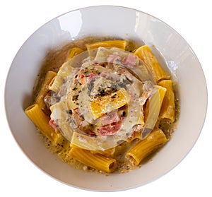 Tortiglioni in carbonara cheese sauce with cured meat guanciale