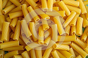 Tortiglioni italian pasta is short pasta with ribbed surface and straight cut, similar to small tubes