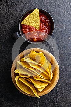 Tortilla chips and red tomato salsa dip. Mexican nacho chips