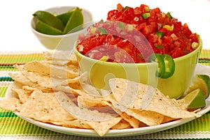 Tortilla chips with salsa and lime