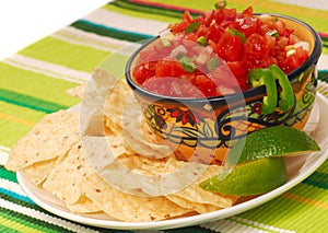 Tortilla chips with salsa and lime