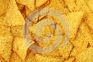 Tortilla corn chips full background texture. Mexican nachos food