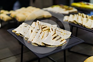 Tortilla with filling on a tray for catering photo