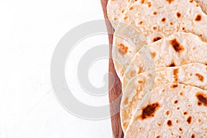 Tortilla flatbreads on the wooden board