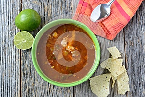 Tortilla Soup with Chips, fresh lime and spoon