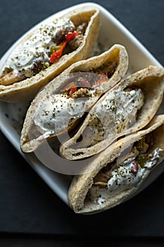 Tortilla stuffed with chicken and vegetables with sour cream. Fajita