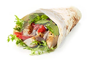 Tortilla wrap with fried chicken meat and vegetables