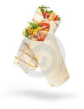 Tortilla wrap with fried chicken meat and vegetables isolated on white background