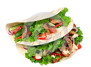 Tortilla wrap with fried chicken meat and vegetables isolated on white background. fast food